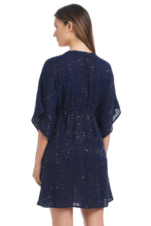 Golden Hour Bleu Rod caftan cover-up featuring flowing fabric and intricate patterns, perfect for beach or poolside wear.