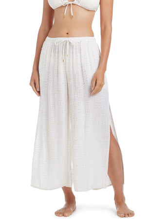 White Golden Hour Side Slit Cover Up Pant by Bleu Rod, lightweight fabric with side slits for a relaxed beachwear look.