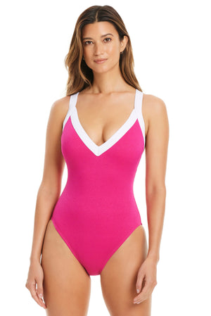 Pink plunge V-neck crossback one-piece swimsuit by Bleu Rod, featuring a stylish design and comfortable fit.