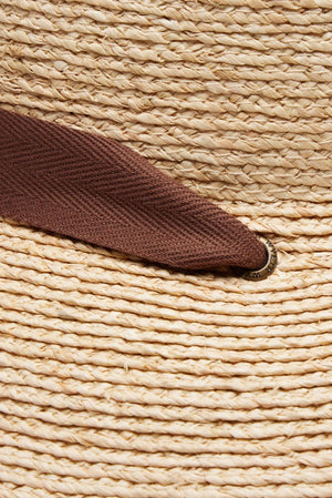 WYETH Thea braided raffia wide brim sunhat with a stylish, natural woven design for sun protection and fashion.