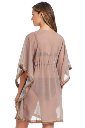 Dark nude Bleu Rod Fringe Benefits caftan coverup with fringe details, flowing fabric, and relaxed fit, shown from the back.
