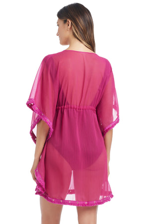 Pink Fringe Benefits caftan coverup by Bleu Rod with fringed hem, flowing silhouette, and vibrant design, back view.