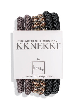 Six black and brown KKNEKKI premium hair ties in a slim bundle, ideal for gentle, secure hair styling.