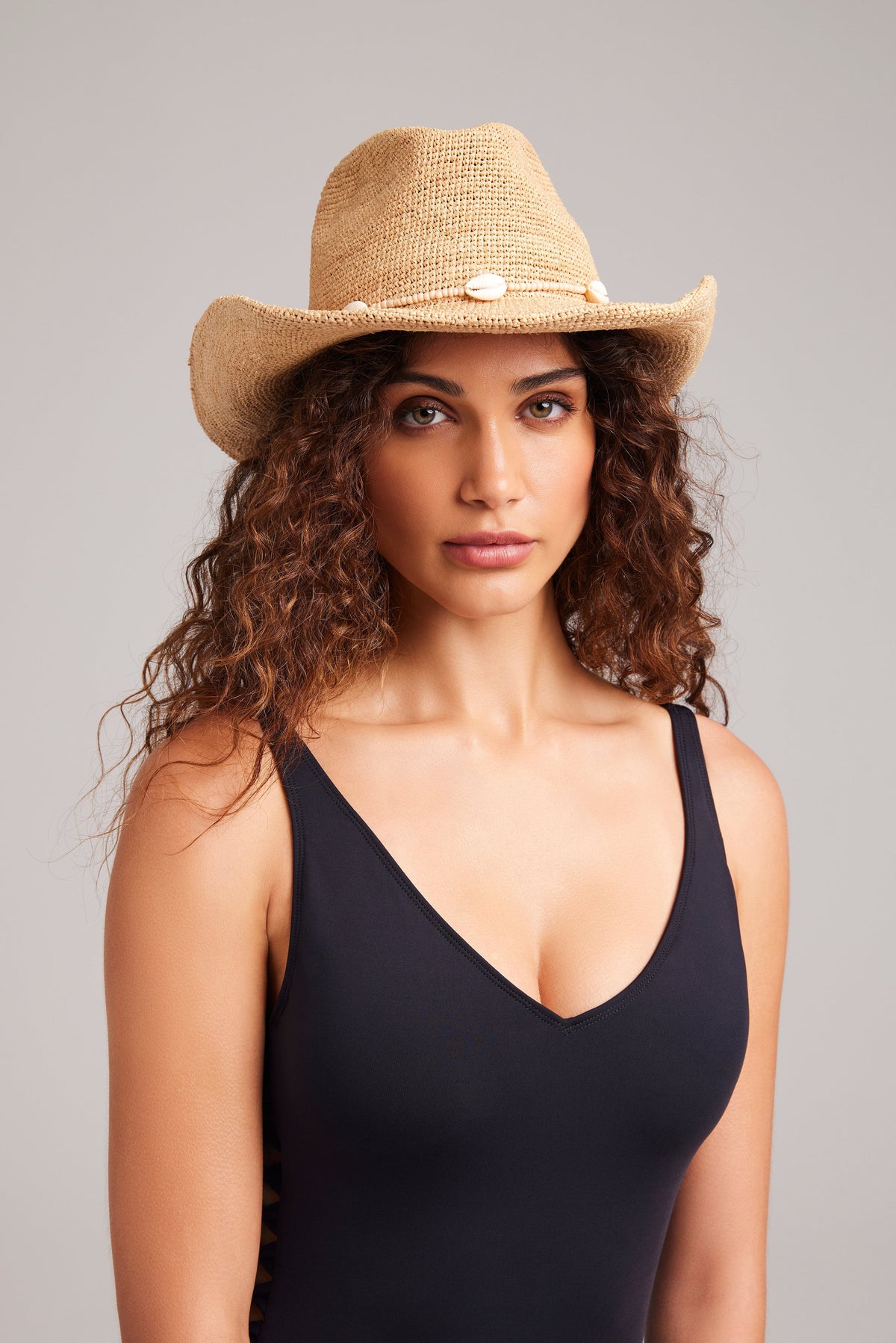 Wyeth Reed cowboy hat in natural color, showcasing a classic wide-brim hat made of straw material with a simple band detail.
