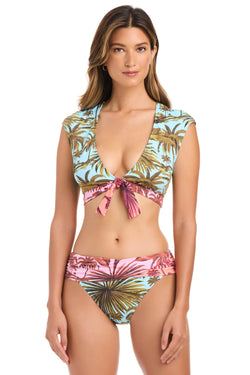 White Lotus print Bleu Rod crop top bikini top with adjustable straps and supportive fit, ideal for beach or poolside wear.