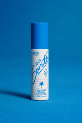 Vacation Super Spritz SPF 50 face mist sunscreen in a portable spray bottle, designed for quick sun protection and refreshing skin.
