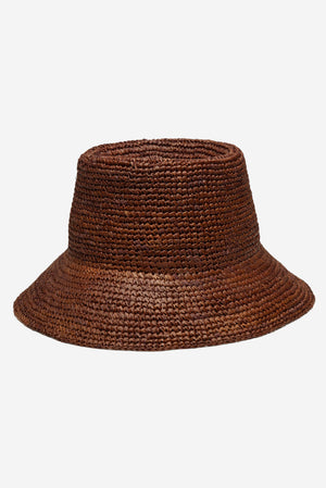 WYETH Tali Raffia Bucket in Chocolate, a stylish woven raffia bag with a rounded shape and top handle in rich chocolate color.